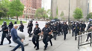 An elderly man falls after appearing to be shoved by riot police during a protest against the death in Minneapolis police custody of George Floyd, in Buffalo, New York, US June 4, 2020 in this still image taken from video. 