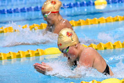 Lara van Niekerk leads against Tatjana Schoenmaker in the 100m breaststroke final in Gqeberha on Saturday night. 