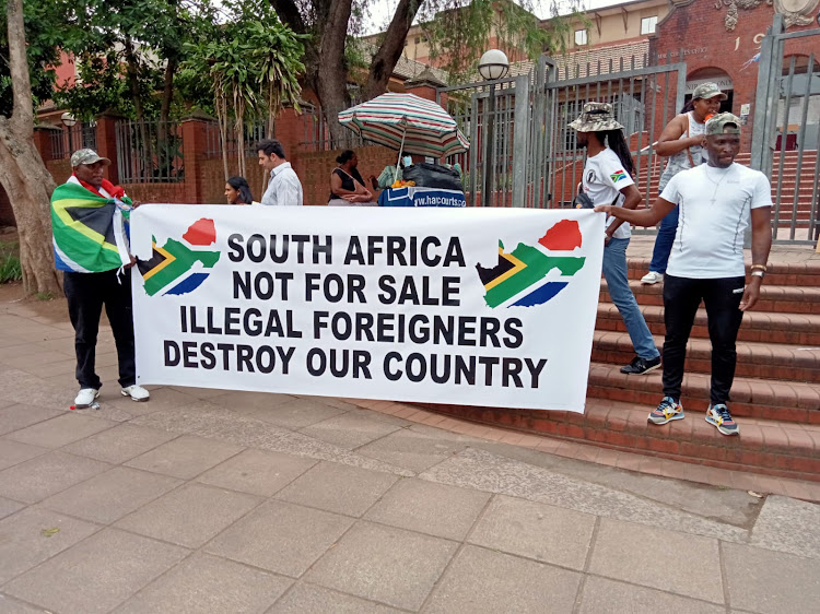 A group outside the Pinetown magistrate's court on Friday where a Zimbabwean-born truck driver appeared on culpable homicide charges.