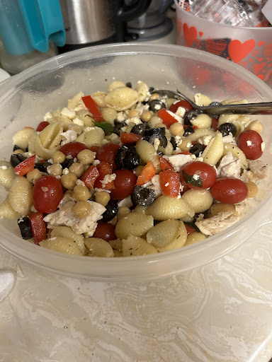 Pasta, olives, tomatoes, chickpeas,/garbanzo, beans, olive oil, real basil, leaves, and bits of garlic. A delightful summer salad. chilling is best but not necessary