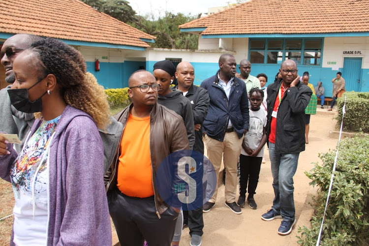 Nairobi Senator Johnson Sakaja waiting in line to cast his vote at St Georges Primary School, Dagoretti North Constituency on August 9, 2022.