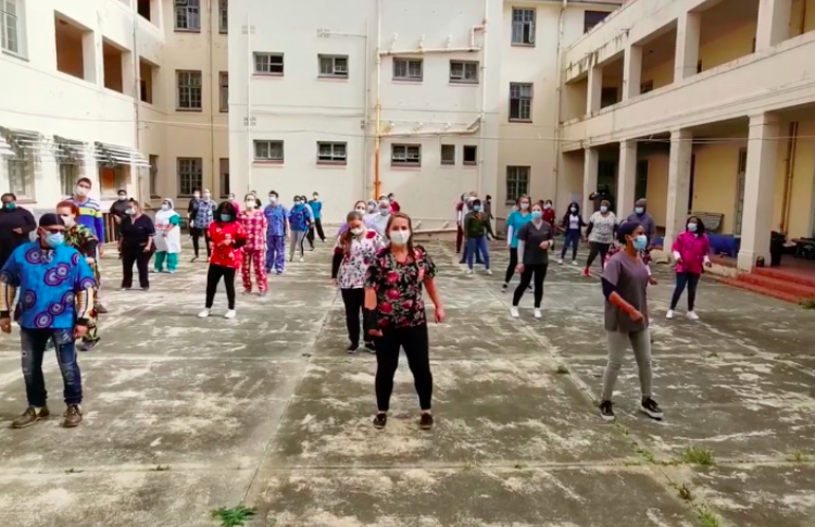 Health-care workers dancing for the #WeWillRise challenge.