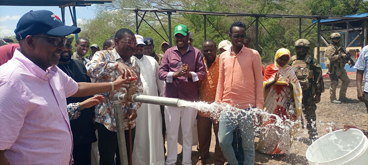 National Assembly speaker Mosses Wetangula and Defense CS Aden Duale when he commissioned a water project in Bura town, Fafi constituency.