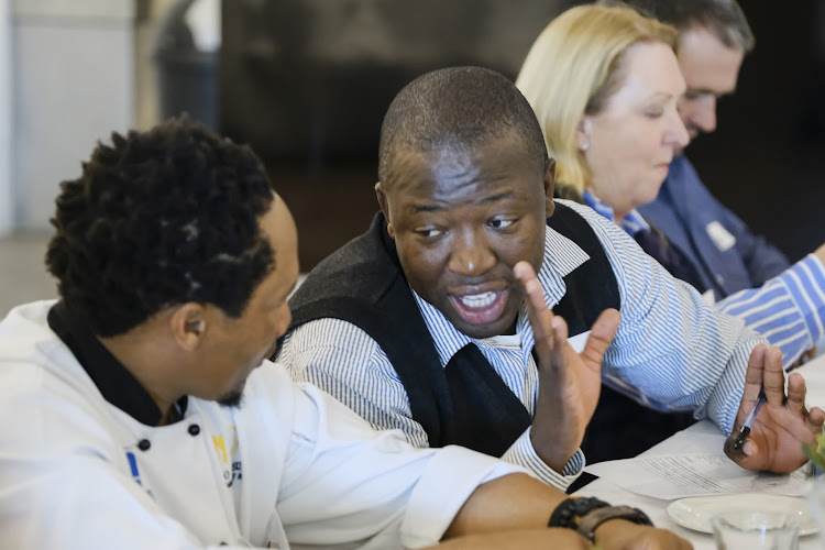 Kabelo Segone talks flavours with a fellow judge during our taste test.