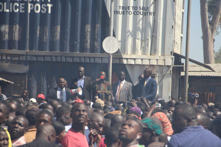 Raila Odinga addressing Kibra residents after Toi Market inferno that razed down a section of the market on Tuesday 12/ EZEKIEL AMINGA