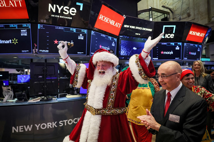 Macy's Santa Claus appears on the trading floor to celebrate the 97th Macy's Thanksgiving Day Parade at the New York Stock Exchange in New York City, US, November 22, 2023.