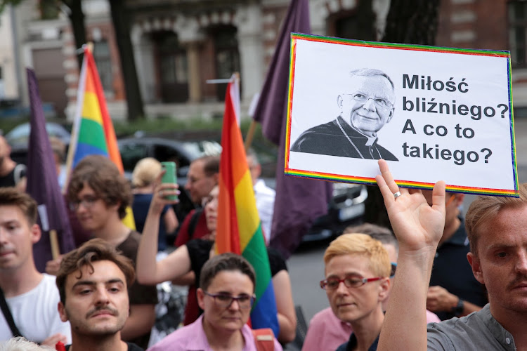 People protest after Polish bishop likens LGBT+ rainbow flag to "communist plague" in Warsaw.