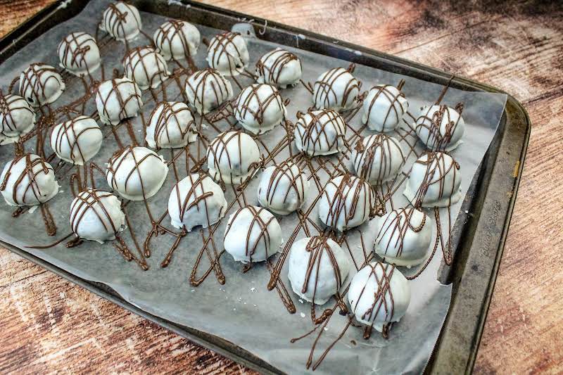 Drizzling Balls With Melted Chocolate.