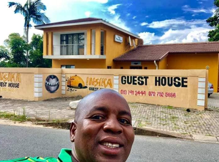 Philemon Lukhele poses outside his guest house in Mbombela.