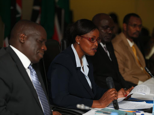 IEBC Commissioner Consolata Nkatha reads to Bungoma Governor Ken Lusaka the judgement by IEBC's dispute committee where he and his opponent Wycliffe Wangamati (not in picture) were each fined 1 million shillings in Nairobi on June 22, 2017. /Jack Owuor