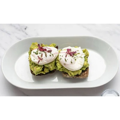 Two Poached Eggs On Avocado On Sourdough