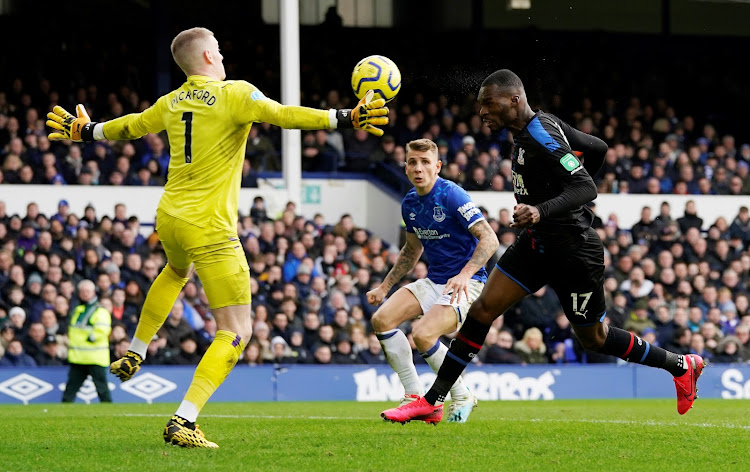 Everton's Jordan Pickford in action against Crystal Palace's Christian Benteke