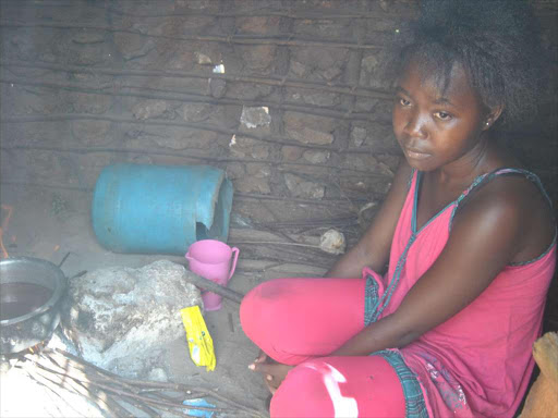 Jessica Mbela prepares tea for her family in Jimba in Kilifi county. Her mother died of torture in the Middle East. /ALPHONCE GARI