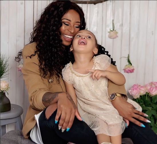 Zinhle with her and AKA's baby girl, Kairo.