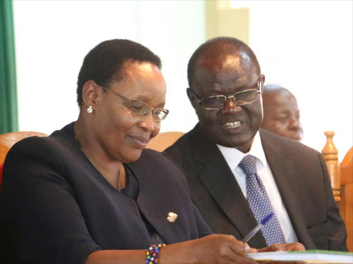 Meru governor Kiraitu Murungi and Eastern Education Coordinator Margaret Lesuuda at Kaaga Girls High School in Meru town during education stakeholders meeting over fire incidences in schools on July 11./GERALD MUTETHIA