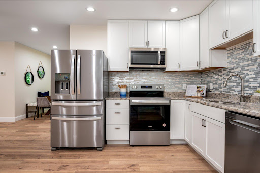 Modern kitchen with stainless steel refrigerator - Prestige property for sale in Crownsville, 4 bedrooms