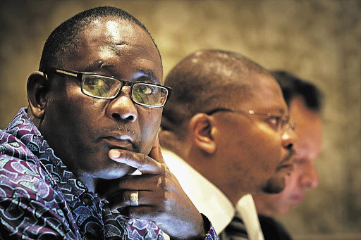 Cosatu secretary-general Zwelinzima Vavi, Avusa editor-in-chief Mondli Makhanya and National Press Club chairman Yusuf Abramjee map out protest action against the Protection of State Information Bill in Sandton, Johannesburg.