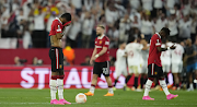 Manchester United forward Marcus Rashford reacts after Sevilla's third goal during their UEFA Europa League quarterfinal second match at Estadio Ramon Sanchez Pizjuan on April 20, 2023 in Seville, Spain.