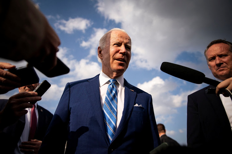 US President Biden speaks to reporters while departing at Des Moines International Airport in Des Moines, Iowa, US, April 12, 2022.