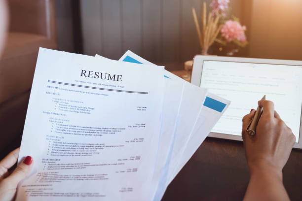 a woman reading a resume