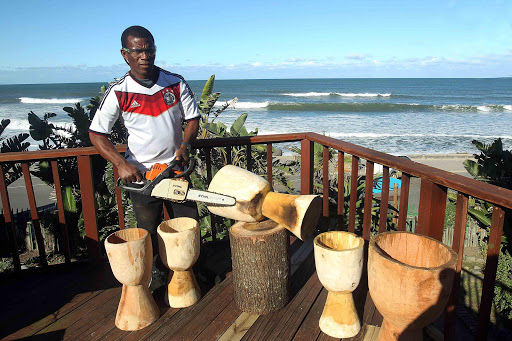 SWITCH: Well-known East London djembe drum-maker Richard Pipe has doubled his output since he exchanged his chisel and hammer for a chainsaw Picture: SIBONGILE NGALWA