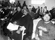 UNHAPPY: Families of apartheid victims and some survivors at a meeting. 14/08/07. © Uknown.