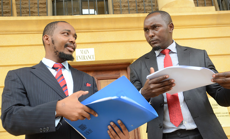 Chama Cha Mawakili lawyers Felix Kiprono and Vincent Yegon outside Milimani law court on April 11, 2022.