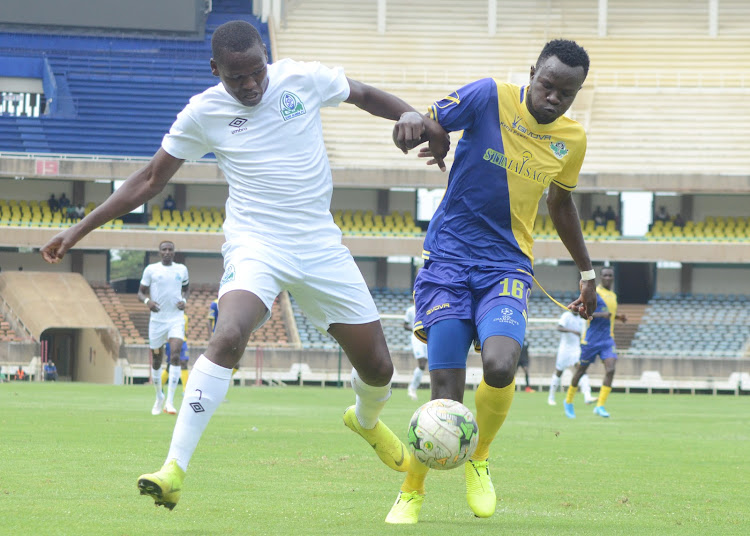 Kennedy Owino, one of the players who left Stima in past action with Gor Mahia's Nicholas Kipkirui