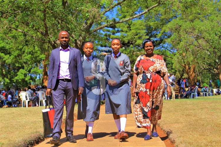 Laveen Wambui Kimotho and Bakhita Wanjiku Murayah escorted by their uncle Joseph Mwangi and grandmother Jacinta Wanjiku to class after successfully being admitted at Kenya High school on February 6,2023.