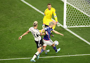 Takuma Asano scores Japan's second goal past Manuel Neuer of Germany in the World Group E match at Khalifa International Stadium in Doha, Qatar on November 23 2022.