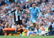 Kieran Trippier of Newcastle United challenges Jack Grealish of Manchester City in the Premier League match at Etihad Stadium in Manchester on May 8 2022.