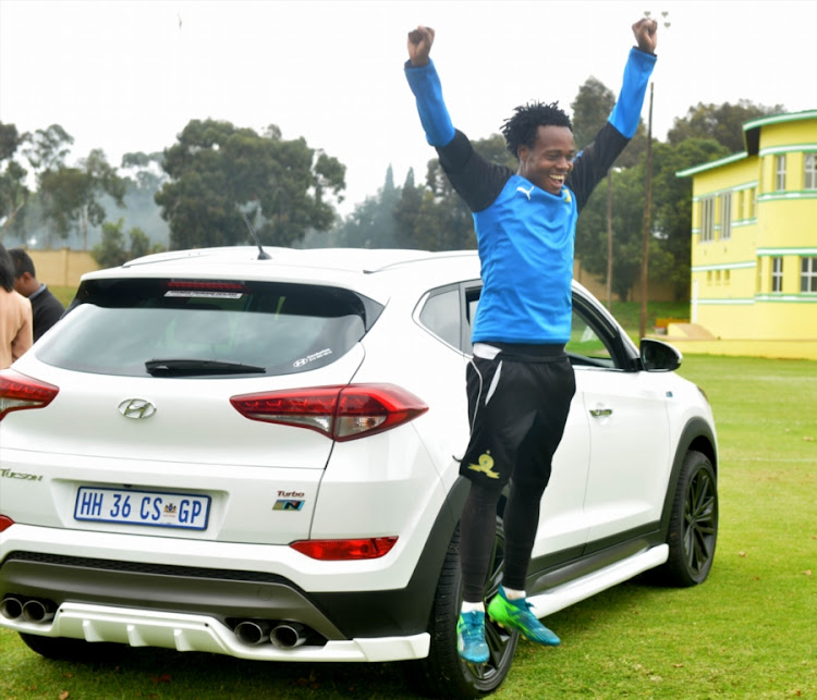 Bafana Bafana and Mamelodi Sundowns star forward Percy Tau ecstatic after being presented with a brand new car from the club's vehicle partner Hyundai during an open media day at Chloorkop training base on April 12 2018.