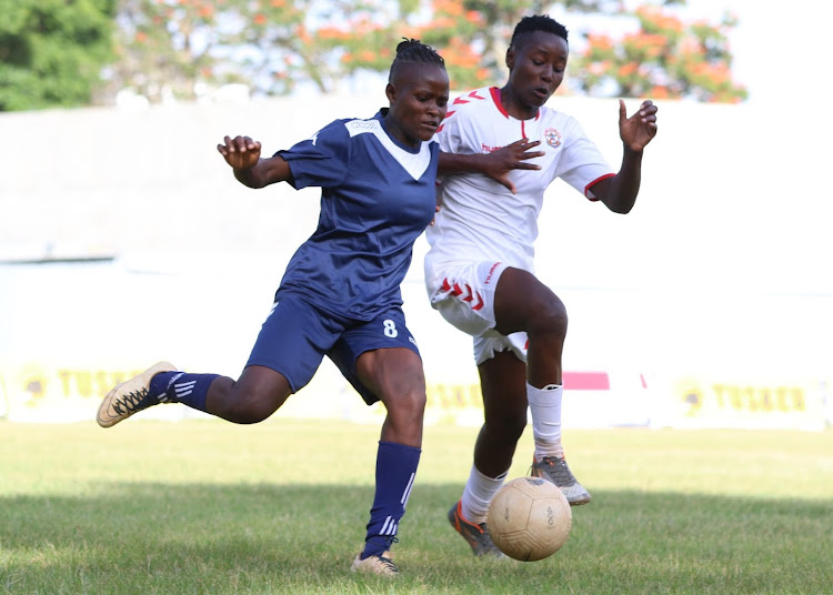 Trans-Nzoia Falcons' Elizabeth Nafula (L) challenges Siliya Rasoa of Ulinzi Starlets in a past match