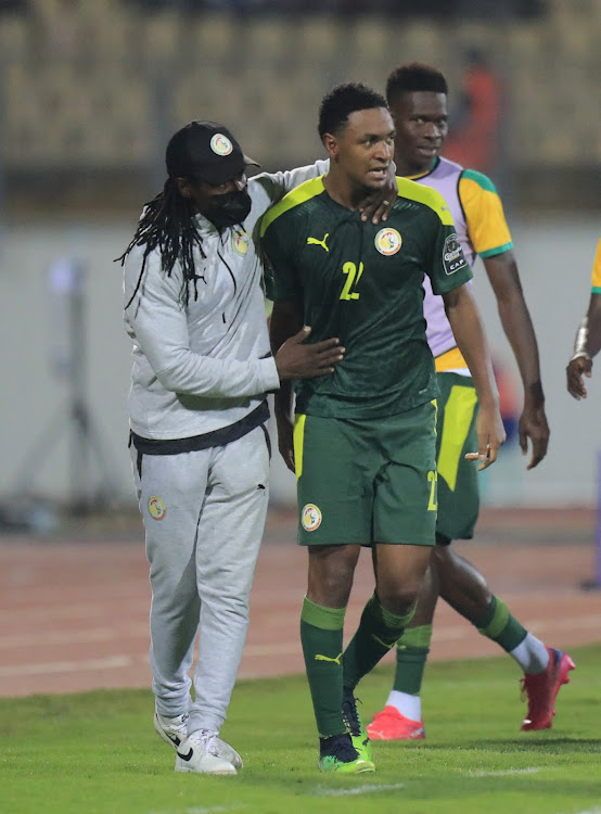 Senegal coach Aliou Cisse with Abdou Diallo