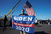 Supporters of Democratic U.S. presidential nominee Joe Biden celebrate near the site of his planned election victory celebration after news media projected Biden as the winner of the 2020 U.S. presidential election in Wilmington, Delaware, U.S., November 7, 2020. 