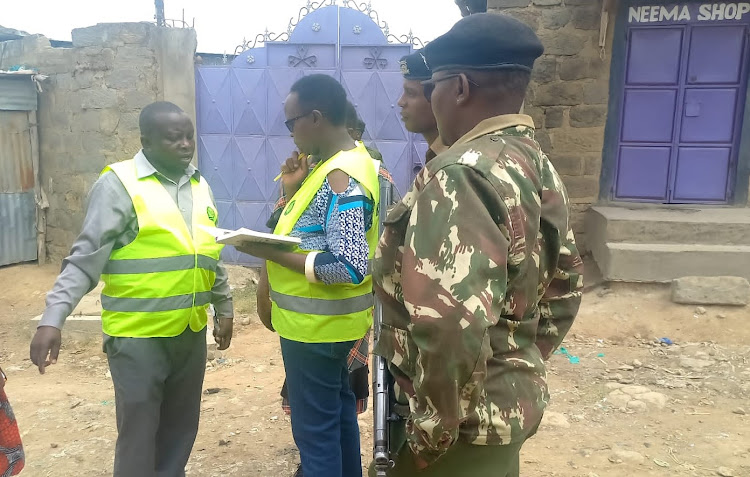 Narok Water and Sewerage Company officials and the police officers during a crackdown on illefgal water connections in Narok town.