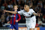 Kylian Mbappé celebrates scoring Paris St-Germain's third goal in their Uefa Champions League quarterfinal second leg against FC Barcelona at Estadi Olimpic Lluis Companys in Barcelona on Tuesday night