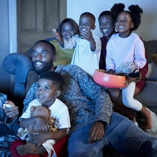 A family watching TV.