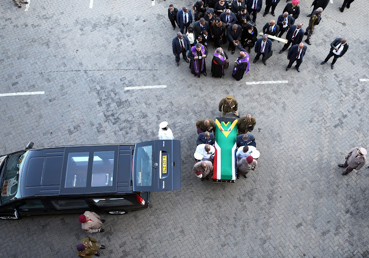 The coffin of Winnie Madikizela-Mandela is carried from the hearse into Orlando Stadium ahead of her funeral.