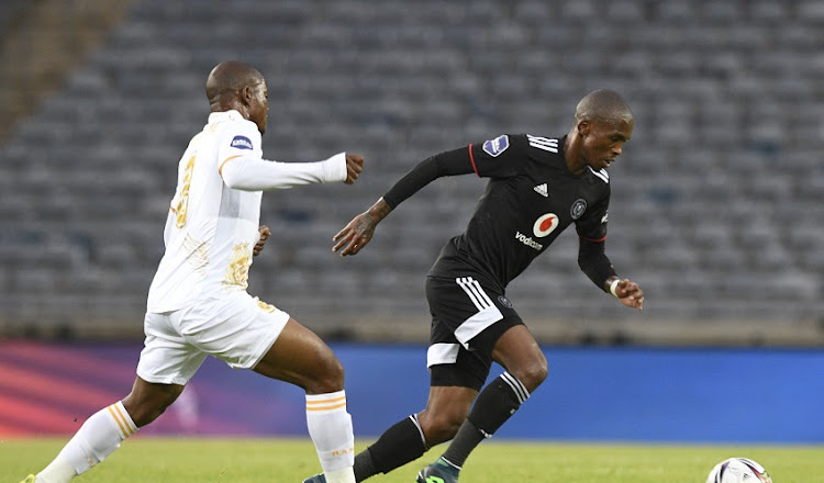 Thabang Monare of Orlando Pirates challenges Lantshene Phalane of Royal AM during their DStv Premiership match at Orlando Stadium.