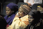 DISTRAUGHT: Family members of Lonmin miners shot dead in August could not contain their emotions as the deaths of their relatives were recounted during the Marikana Commission hearings yesterday Picture: DANIEL BORN
