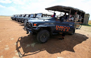 Gladys Kisemei, a tour guide at Emboo River Camp picks up tourists from Ol Kiombo airstrip using an electric-powered safari vehicle at the Maasai Mara National Reserve in Narok County, Kenya July 16, 2021.  