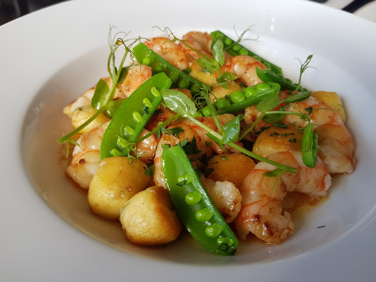 The Moveable Feasts Parisian gnocchi which is made with flour, not potato, with juicy prawns, sugar snap peas in their pods and a lemon sauce.