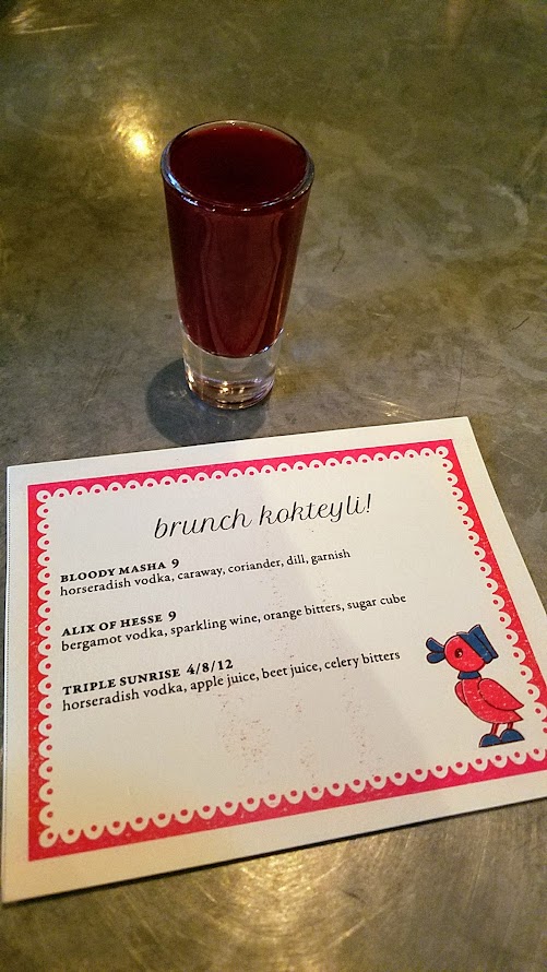 Guests were welcomed to the Kachka brunch celebrating Maslenitsa with a vitamin shot called Triple Sunrise with horseradish vodka, apple juice, beet juice, and celery bitters