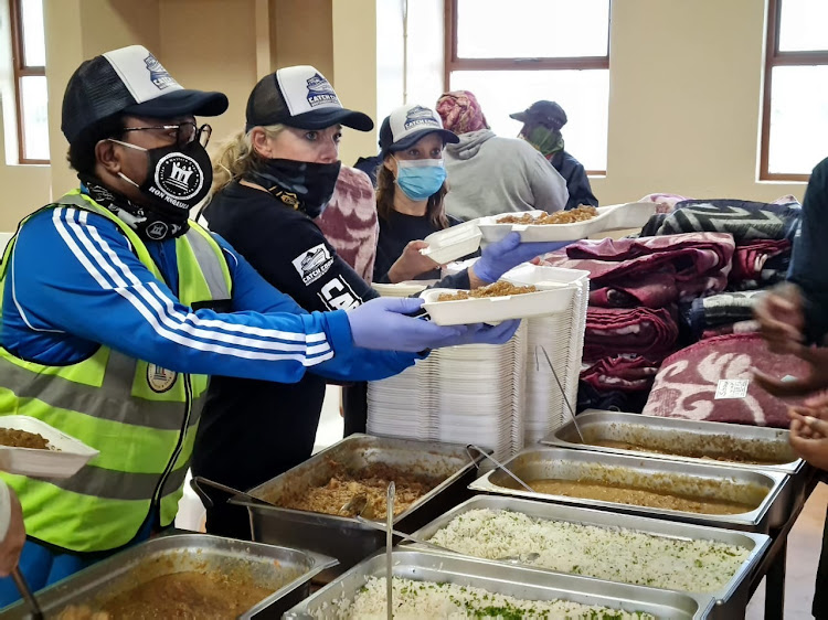 Western Cape legislature speaker Masizole Mnqasela helped with the distribution of food and blankets to Overberg residents displaced by floods.