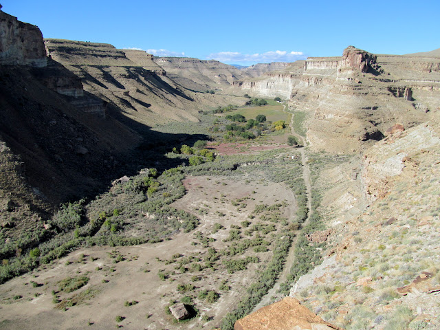 View upstream toward fields and ranch buildings