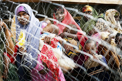 Refugees await food rations at Dadaab camp.