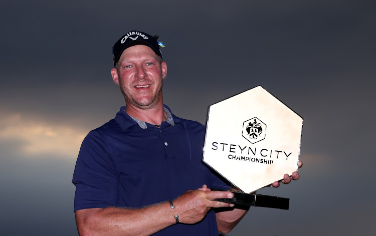 Shaun Norris of SA celebrates with his trophy after the final round of the Steyn City Championship at The Club at Steyn City in Johannesburg. Picture: WARREN LITTLE/GETTY IMAGES