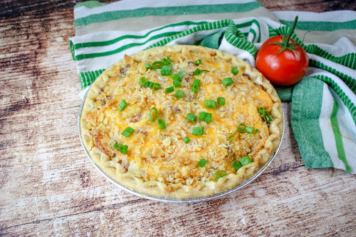 Bacon Onion Tomato Pie ready to be sliced.