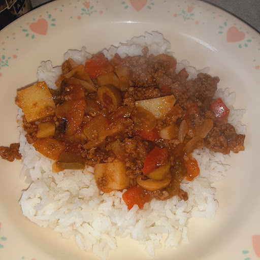 Serving of Spanish Beef Hash with hot rice.